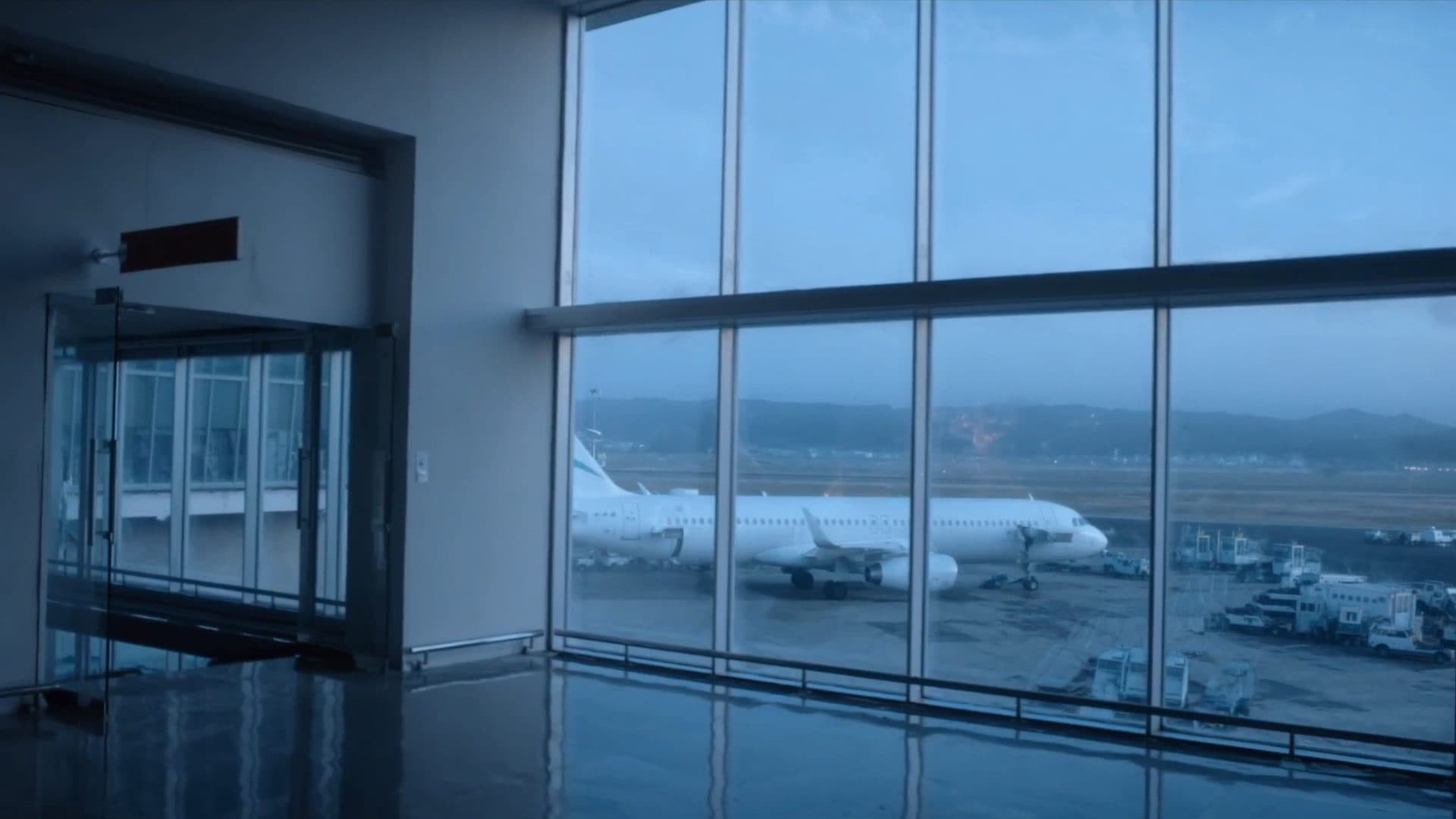 Illustrative: an empty airport terminal pier at first light
