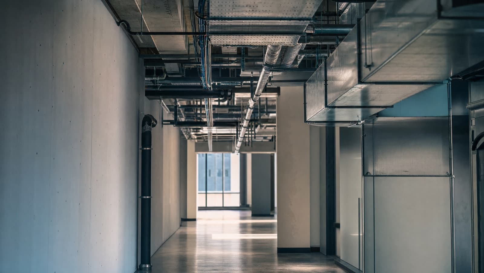 Illustrative: a building-services corridor with clean partitions